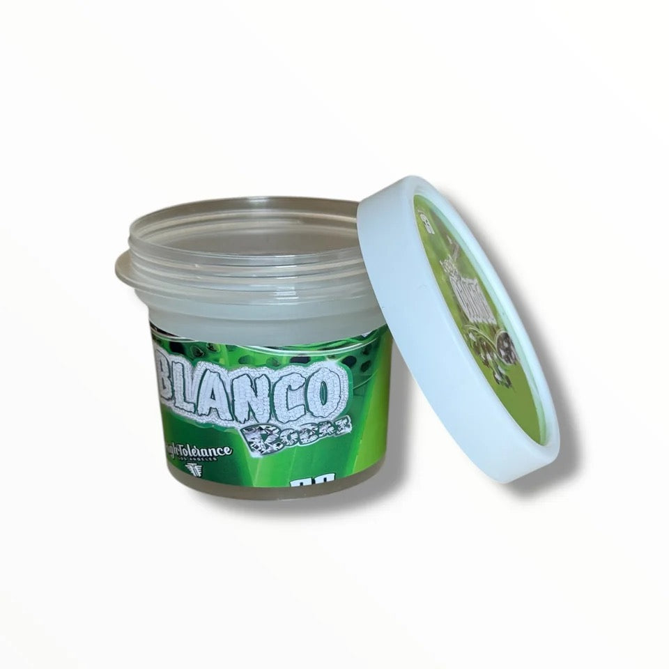Green jar with white lid labeled 'Blanco' on a white background